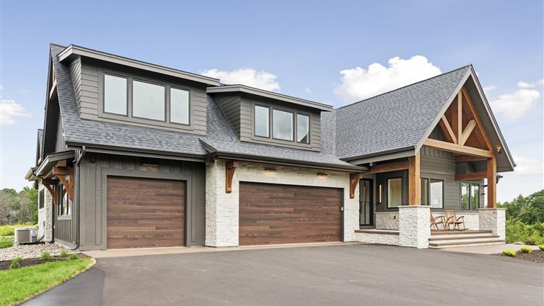 Luxury suburban home with garage and driveway