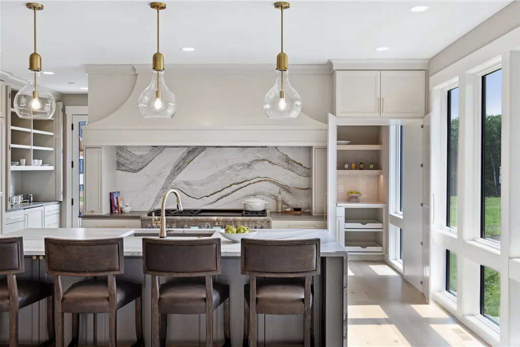 Contemporary dining room with luxury furniture and large windows.