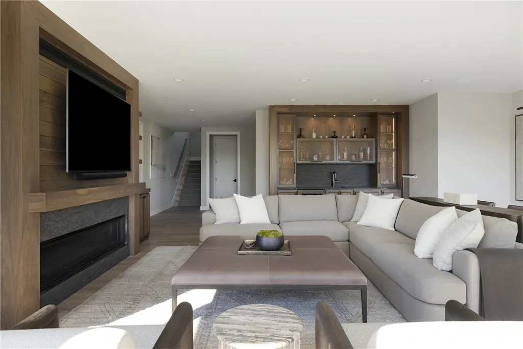 Contemporary luxury living room with minimalist furniture and large windows.