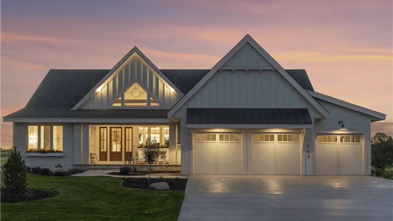 Exterior view of a luxury suburban home with a spacious driveway.
