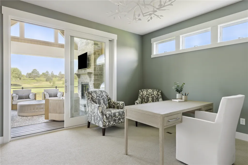 Minimalist home office with contemporary furniture and large window.