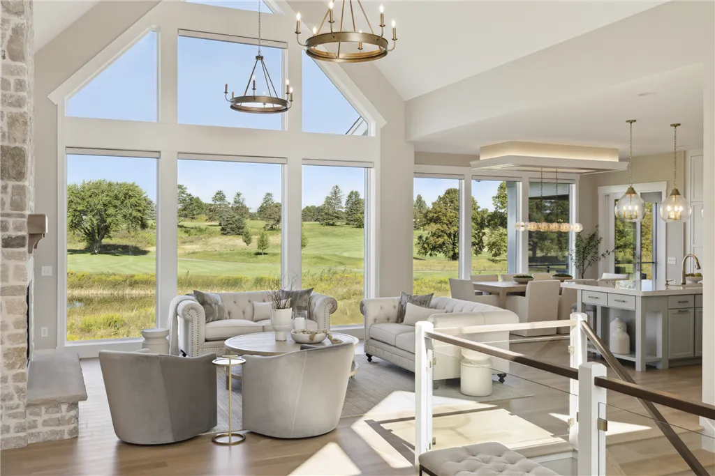 Contemporary minimalist dining room with large windows and elegant furniture.