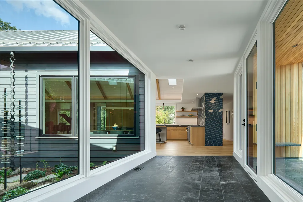 Interior view of a contemporary luxury home with large windows and minimalist design.