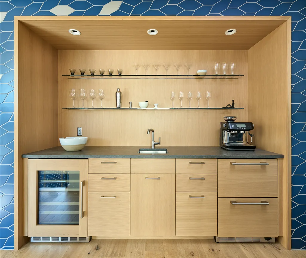Contemporary minimalist kitchen with wooden cabinets, stainless steel appliances, and modern design.
