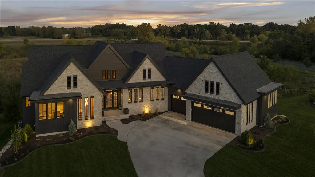 Charming suburban bungalow with a spacious driveway and lush greenery.