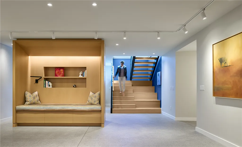 Contemporary basement stairway with minimalist interior design and modern furniture.